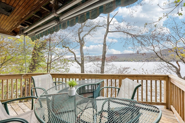 wooden deck with outdoor dining space