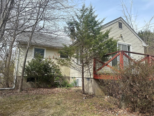 view of property exterior featuring a deck