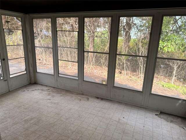 unfurnished sunroom with a wealth of natural light