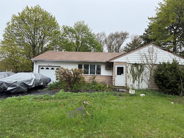 11 Columbus Ave, Brentwood, NY 11717 - ranch-style house with aphalt driveway and an attached garage