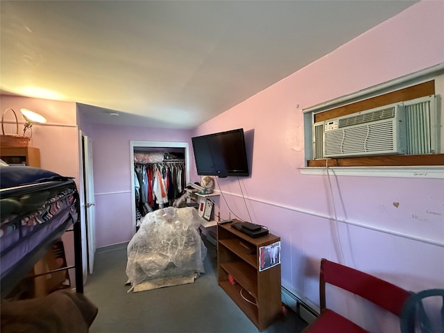 11 Columbus Ave, Brentwood, NY 11717 - bedroom featuring a baseboard radiator, a wall mounted air conditioner, and a closet
