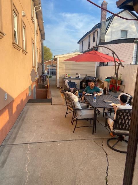 view of patio / terrace with outdoor dining space and fence