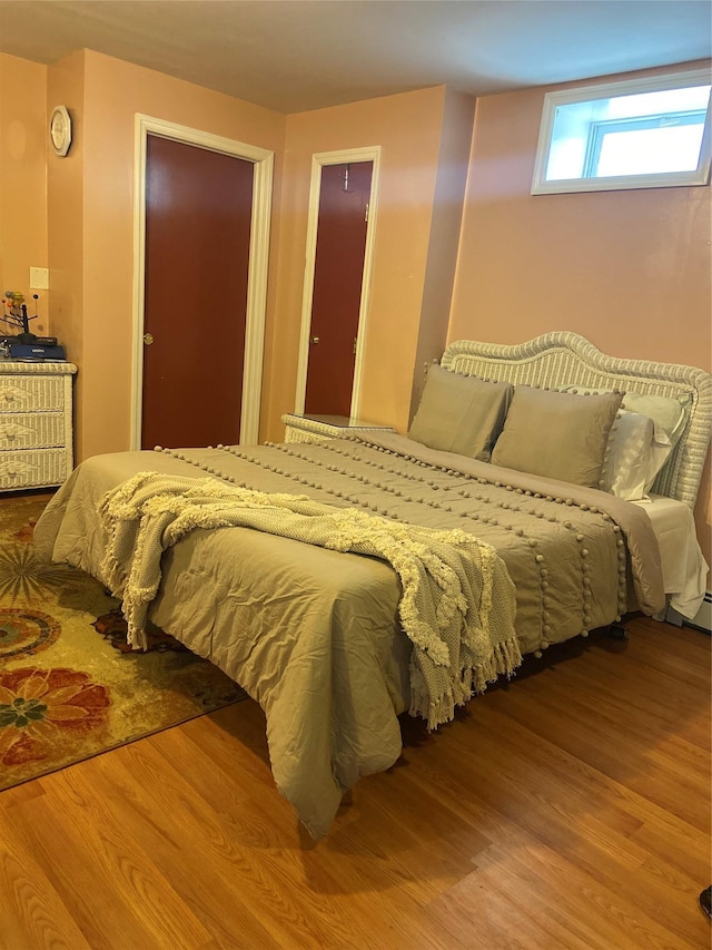 bedroom featuring wood finished floors