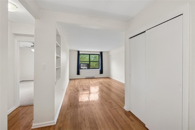 212-03 75th Ave Unit 5A, Bayside, NY 11364 - hallway featuring wood finished floors, baseboards, and cooling unit