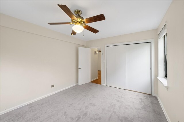 212-03 75th Ave Unit 5A, Bayside, NY 11364 - unfurnished bedroom with carpet floors, a closet, a ceiling fan, and baseboards