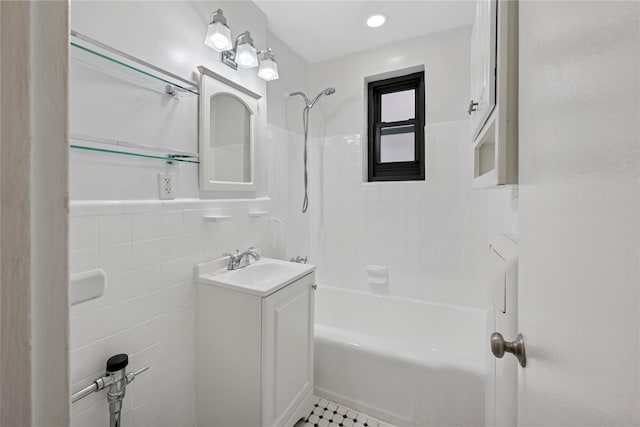 212-03 75th Ave Unit 5A, Bayside, NY 11364 - bathroom featuring tile walls, shower / washtub combination, vanity, and a wainscoted wall