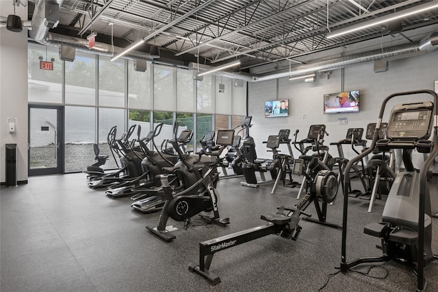 212-03 75th Ave Unit 5A, Bayside, NY 11364 - exercise room with floor to ceiling windows and a high ceiling