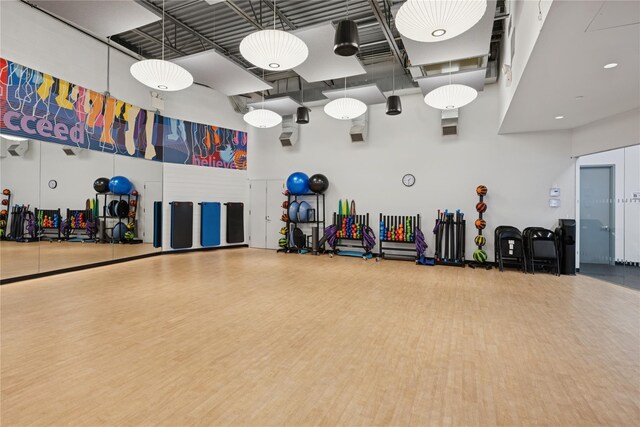 212-03 75th Ave Unit 5A, Bayside, NY 11364 - misc room with a towering ceiling and wood finished floors