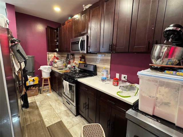 33-40 101st St, Corona, NY 11368 - kitchen with tasteful backsplash, dark brown cabinetry, recessed lighting, stainless steel appliances, and light countertops