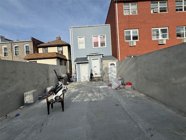 33-40 101st St, Corona, NY 11368 - rear view of property with a shed, a patio, fence private yard, and an outbuilding