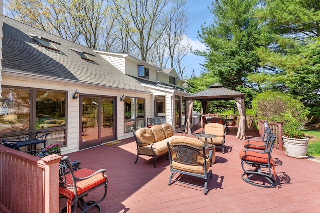 deck with a gazebo and an outdoor hangout area