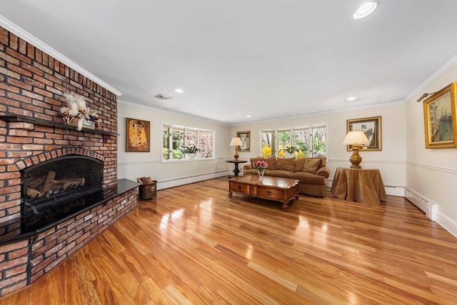 living area featuring baseboard heating, wood finished floors, crown molding, and a baseboard radiator