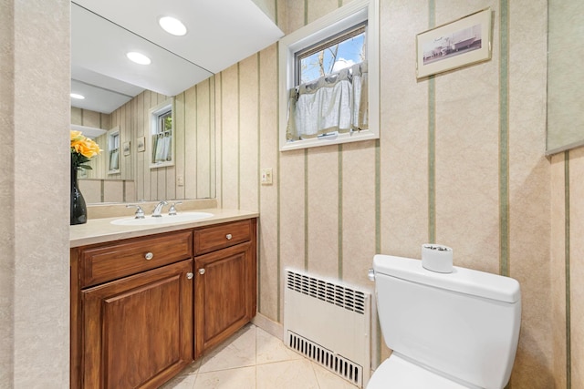 bathroom featuring recessed lighting, radiator, toilet, and vanity