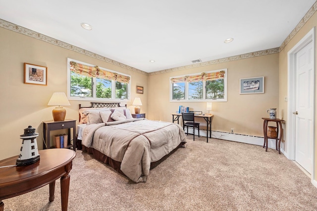 bedroom featuring a baseboard heating unit, recessed lighting, and light colored carpet