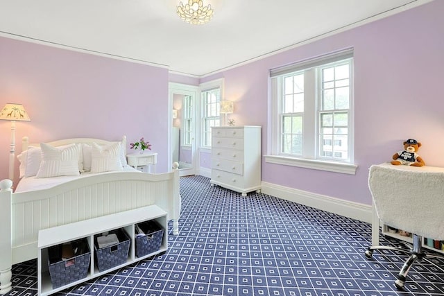 carpeted bedroom featuring baseboards
