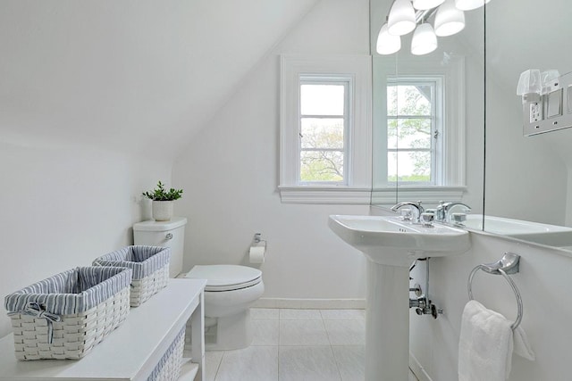 bathroom with baseboards, a notable chandelier, vaulted ceiling, and toilet