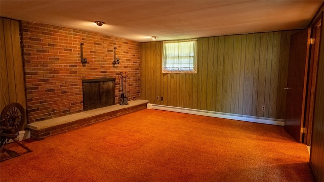 unfurnished living room featuring a brick fireplace, wooden walls, carpet, and a baseboard radiator
