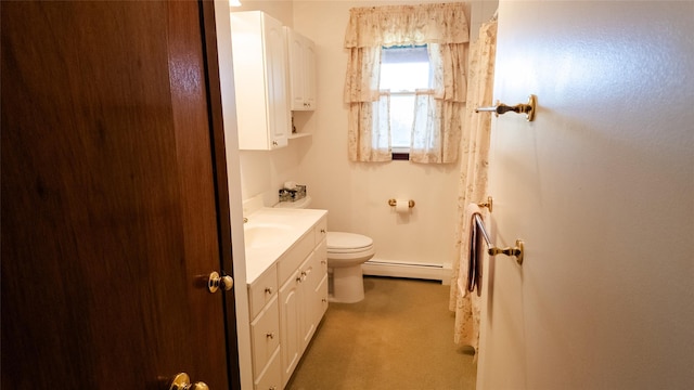 bathroom with vanity, toilet, and a baseboard radiator