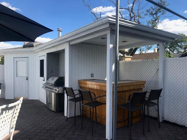 158-35 91st St, Howard Beach, NY 11414 - view of patio / terrace featuring fence, outdoor dry bar, and grilling area