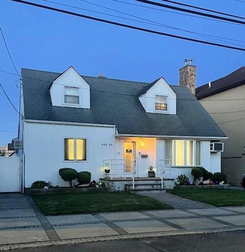 158-35 91st St, Howard Beach, NY 11414 - cape cod house with a chimney and a front yard