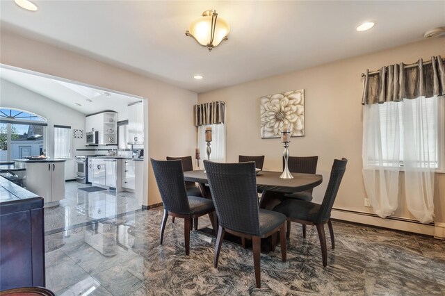 158-35 91st St, Howard Beach, NY 11414 - dining area with vaulted ceiling with skylight, a baseboard heating unit, recessed lighting, and marble finish floor