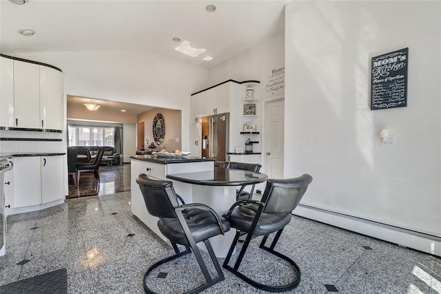 158-35 91st St, Howard Beach, NY 11414 - dining area with a baseboard heating unit, granite finish floor, and high vaulted ceiling