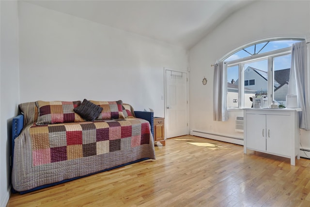 158-35 91st St, Howard Beach, NY 11414 - bedroom with a baseboard radiator, wood finished floors, and vaulted ceiling