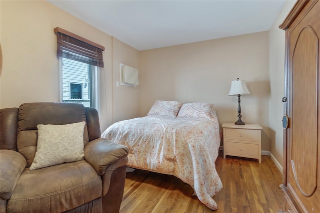 158-35 91st St, Howard Beach, NY 11414 - bedroom with baseboards and light wood-type flooring