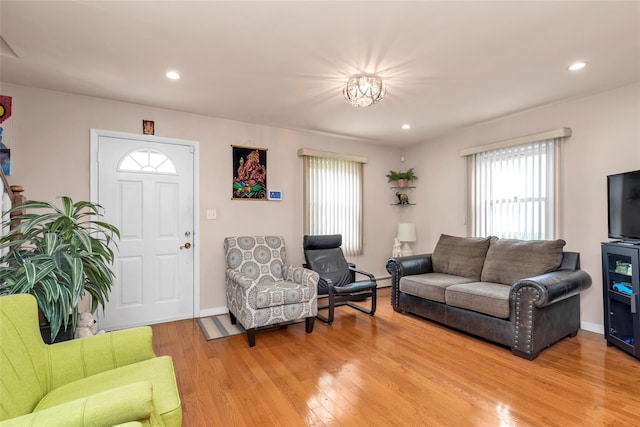 102 Spruce Ln, Valley Stream, NY 11581 - living room featuring healthy amount of natural light, light wood-style floors, baseboards, and recessed lighting