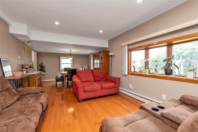 102 Spruce Ln, Valley Stream, NY 11581 - living area featuring a baseboard radiator, light wood finished floors, recessed lighting, and baseboards