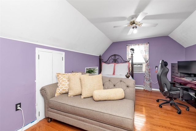 102 Spruce Ln, Valley Stream, NY 11581 - bedroom featuring a desk, vaulted ceiling, light wood-style floors, cooling unit, and ceiling fan