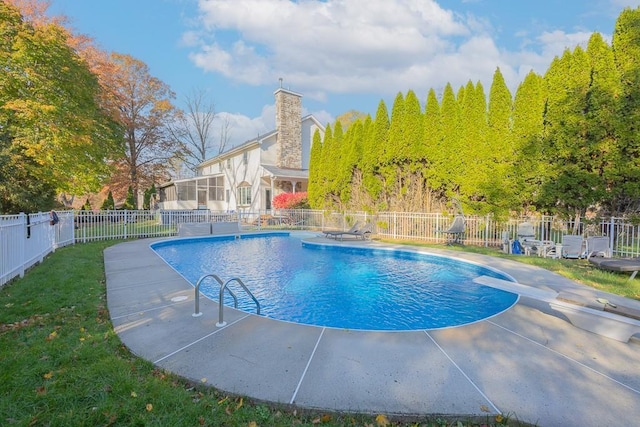 view of swimming pool featuring a fenced in pool, a diving board, and fence