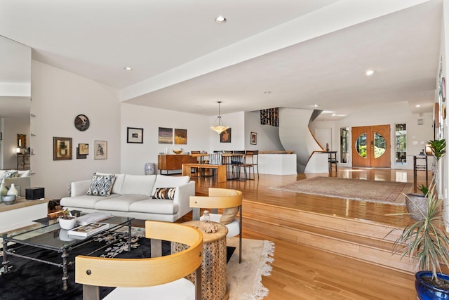 living room with recessed lighting and light wood-type flooring
