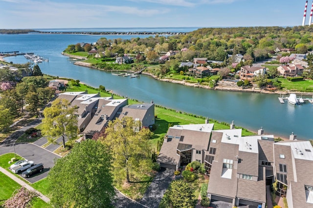 drone / aerial view featuring a water view and a residential view