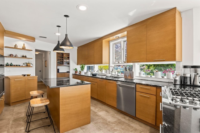 kitchen with visible vents, open shelves, a center island, a sink, and stainless steel appliances