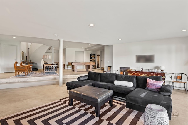 living area featuring recessed lighting and stairs