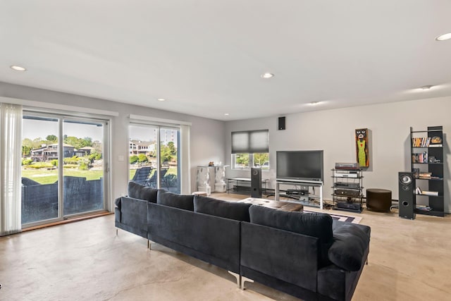 living area with recessed lighting and finished concrete floors