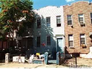 rear view of property with fence