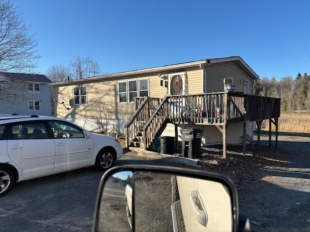 view of front of house with a deck