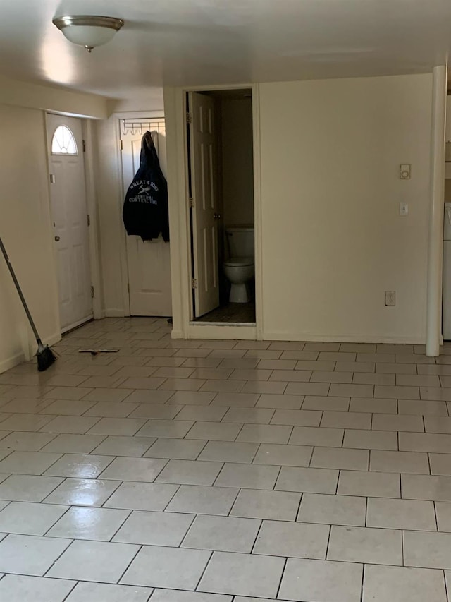 foyer entrance with light tile patterned floors