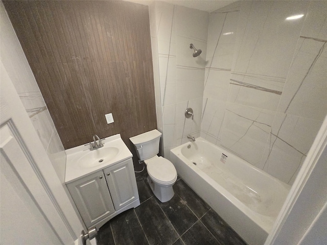 bathroom featuring toilet, shower / washtub combination, and vanity