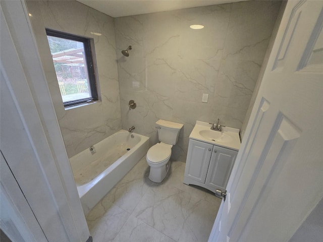 bathroom featuring shower / bathing tub combination, tile walls, vanity, toilet, and marble finish floor
