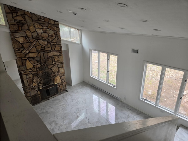 unfurnished living room featuring visible vents, a fireplace, high vaulted ceiling, a baseboard radiator, and marble finish floor