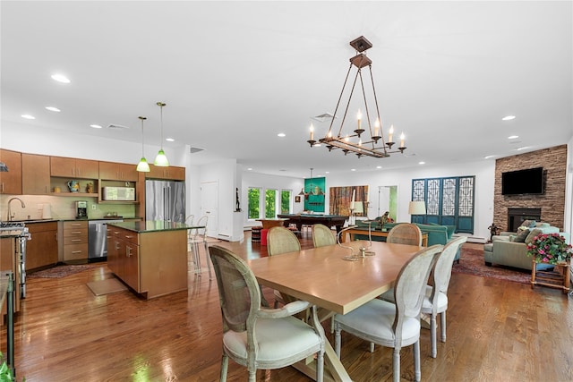 240 Brady Rd, Warwick, NY 10990 - dining space with dark wood-style flooring, recessed lighting, a stone fireplace, and billiards