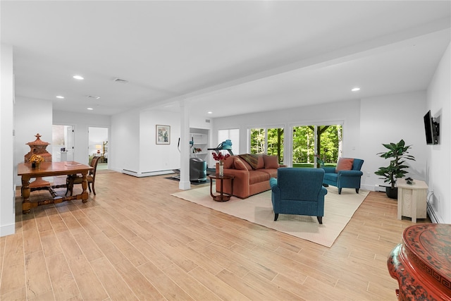 240 Brady Rd, Warwick, NY 10990 - living room with recessed lighting, light wood-type flooring, baseboards, baseboard heating, and decorative columns