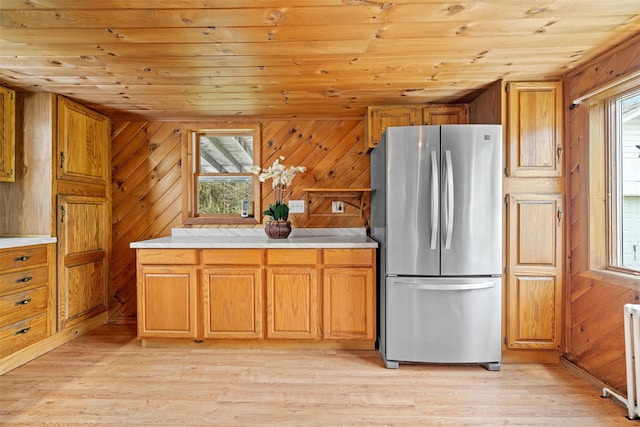 kitchen with wooden ceiling, freestanding refrigerator, and light wood-style flooring
