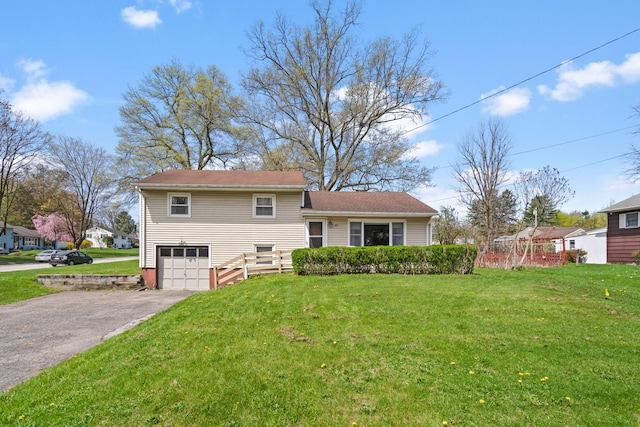 split level home featuring driveway and a garage