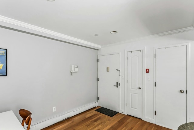foyer featuring crown molding, wood finished floors, and a baseboard radiator