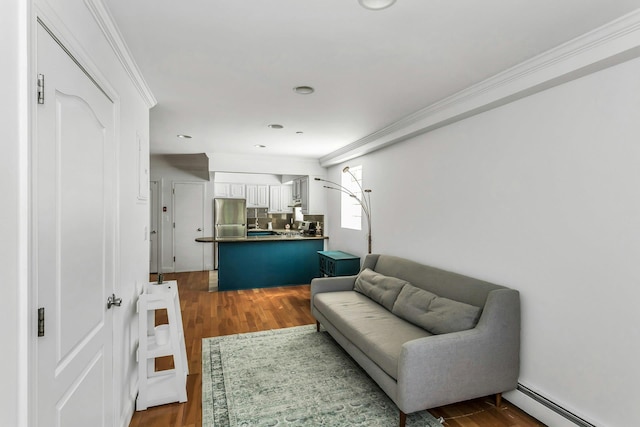 living area featuring crown molding, dark wood-type flooring, a baseboard radiator, and recessed lighting