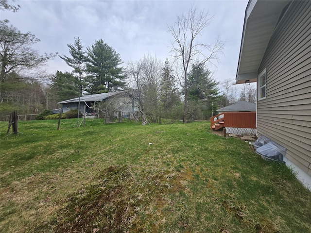 view of yard featuring a wooden deck